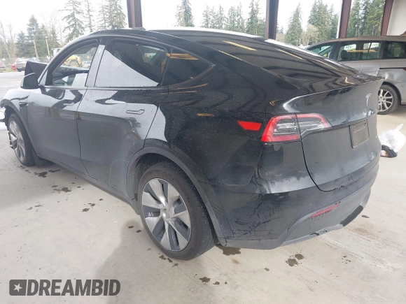 2023 Tesla Model Y Long Range with VIN 7SAYGDEE0PF909610, listed as a IAAI auction lot 41906081 with 20,656 mi miles and . Bid and sale history available at DreamBid. Image 3.