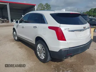 2017 Cadillac XT5 FWD with VIN 1GYKNARS0HZ107734, listed as a IAAI auction lot 41882031 with 89,397 mi miles. Bid and sale history available at carsss.com. Image 3.