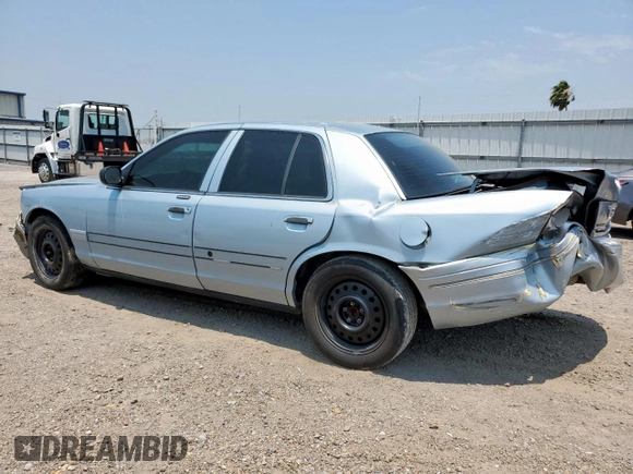 2004 Ford Crown Victoria LX z VIN 2FAFP74W54X184815, wystawiony jako Copart lot #57280725 z przebiegiem 294 513 mil mil oraz Szkoda całkowita • Salvage title. Historia ofert i sprzedaży dostępna na DreamBid. Obrazek 2.
