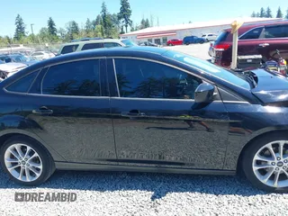 2018 Ford Focus SE z VIN 1FADP3FE5JL279274, wystawiony jako IAAI lot #42626587 z przebiegiem 92 110 mil mil oraz . Historia ofert i sprzedaży dostępna na DreamBid. Obrazek 14.