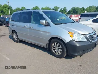 2010 Honda Odyssey EX-L z VIN 5FNRL3H79AB079155, wystawiony jako IAAI lot #42663239 z przebiegiem 172 405 mil mil oraz . Historia ofert i sprzedaży dostępna na DreamBid. Obrazek 1.