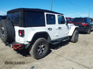 2023 Jeep Wrangler Rubicon with VIN 1C4HJXFG8PW655138, listed as a IAAI auction lot 41674959 with 40,790 mi miles and . Bid and sale history available at DreamBid. Image 4.