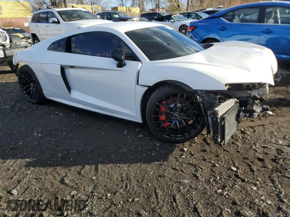 2018 Audi R8 V10 z VIN WUABAAFX5J7902445, wystawiony jako Copart lot #80124934 z przebiegiem Nie podano mil oraz Szkoda całkowita • Salvage title. Historia ofert i sprzedaży dostępna na DreamBid. Obrazek 4.