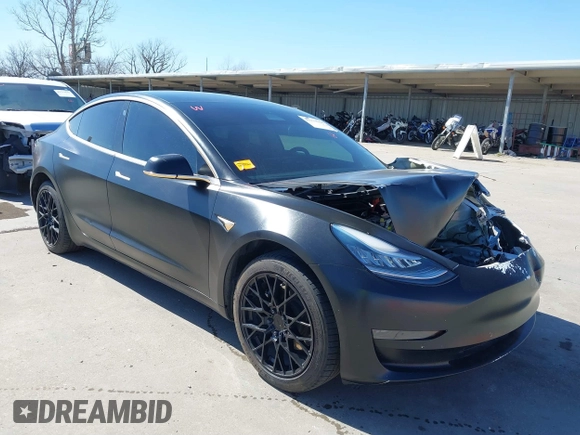 2020 Tesla Model 3 Standard Range Plus with VIN 5YJ3E1EA0LF597761, listed as a IAAI auction lot 41773918 with 89,957 mi miles. Bid and sale history available at carsss.com. Image 1.