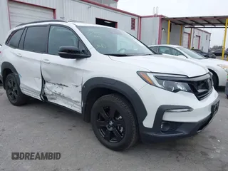 2022 Honda Pilot TrailSport z VIN 5FNYF6H8XNB082116, wystawiony jako IAAI lot #42100968 z przebiegiem 31 697 mil mil oraz . Historia ofert i sprzedaży dostępna na DreamBid. Obrazek 1.