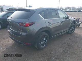 2020 Mazda CX-5 Touring with VIN JM3KFBCM8L0863951, listed as a IAAI auction lot 41921635 with 88,629 mi miles. Bid and sale history available at carsss.com. Image 4.