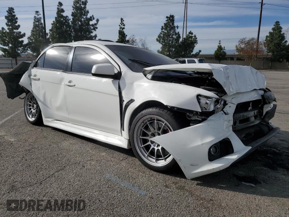 2014 Mitsubishi Lancer Evolution GSR z VIN JA32W8FV2EU019253, wystawiony jako Copart lot #86615084 z przebiegiem 104 894 mil mil oraz Szkody całkowita. Historia ofert i sprzedaży dostępna na DreamBid. Obrazek 4.