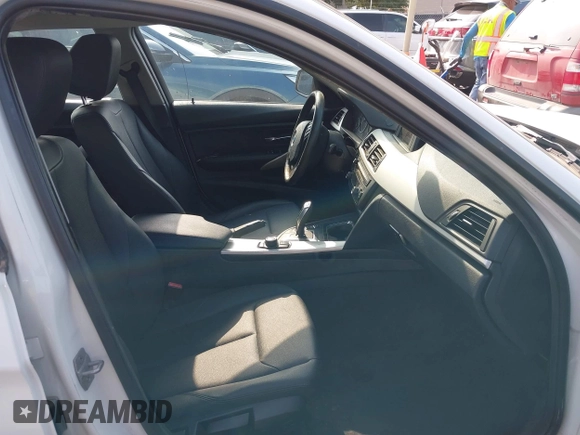 2015 BMW 3 Series 320i with VIN WBA3B1G5XFNT05903, listed as a IAAI auction lot 42063574 with Not Provided miles. Bid and sale history available at carsss.com. Image 5.