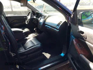 2004 Acura MDX with VIN 2HNYD18244H560067, listed as a IAAI auction lot 41798950 with 175,460 mi miles. Bid and sale history available at carsss.com. Image 5.