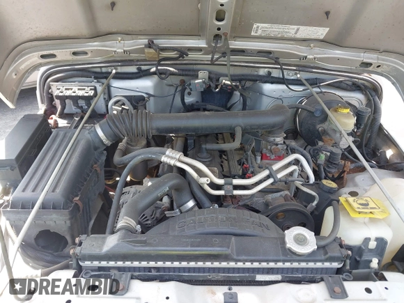 2003 Jeep Wrangler Sport z VIN 1J4FA49S73P302278, wystawiony jako IAAI lot #42219582 z przebiegiem 129 089 mil mil oraz . Historia ofert i sprzedaży dostępna na DreamBid. Obrazek 10.