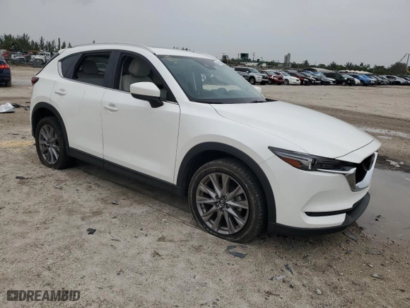 2021 Mazda CX-5 Grand Touring with VIN JM3KFADM2M0309024, listed as a Copart auction lot 71642524 with 0 mi miles and Non Repairable. Bid and sale history available at carsss.com. Image 4.