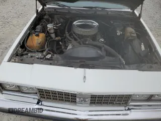 1987 Oldsmobile Cutlass z VIN 1G3GR51Y2HR316707, wystawiony jako Copart lot #69328344 z przebiegiem 70 828 mil mil oraz Szkody całkowita. Historia ofert i sprzedaży dostępna na DreamBid. Obrazek 11.