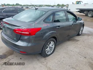 2017 Ford Focus SE with VIN 1FADP3F23HL232809, listed as a IAAI auction lot 42117700 with 104,802 mi miles and . Bid and sale history available at DreamBid. Image 4.
