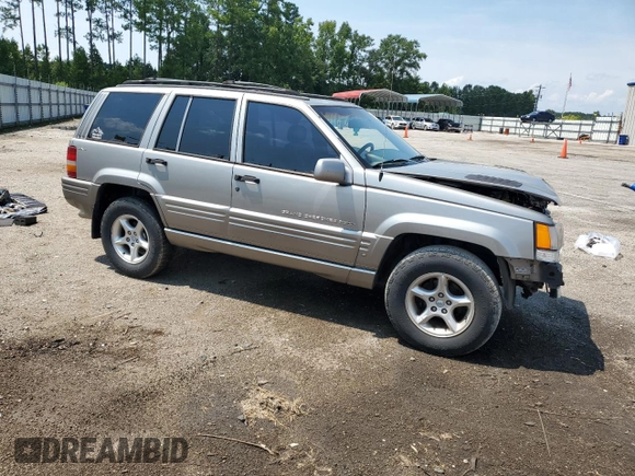 1998 Jeep Grand Cherokee Limited with VIN 1J4GZ88Z9WC148445, listed as a Copart auction lot 65961744 with 180,067 mi miles and Clean Title. Bid and sale history available at carsss.com. Image 4.