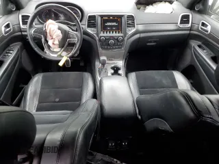 2018 Jeep Grand Cherokee Laredo E with VIN 1C4RJEAGXJC430096, listed as a Copart auction lot 57391405 with 89,248 mi miles and Salvage title. Bid and sale history available at DreamBid. Image 8.