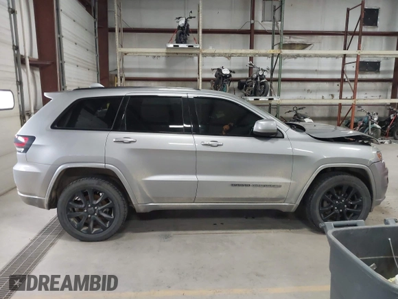 2018 Jeep Grand Cherokee Laredo E with VIN 1C4RJFAG6JC102969, listed as a IAAI auction lot 41963137 with 112,361 mi miles and . Bid and sale history available at DreamBid. Image 13.