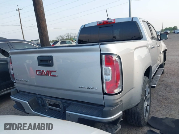 2018 GMC Canyon 2WD Denali z VIN 1GTG5EENXJ1256837, wystawiony jako IAAI lot #42139397 z przebiegiem 93 024 mil mil oraz . Historia ofert i sprzedaży dostępna na DreamBid. Obrazek 4.