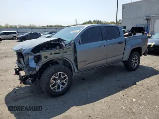 2022 GMC Canyon 4WD AT4 z VIN 1GTG6FEN9N1305549, wystawiony jako Copart lot #52744155 z przebiegiem 22 310 mil mil oraz Szkoda całkowita • Salvage title. Historia ofert i sprzedaży dostępna na DreamBid. Obrazek 1.