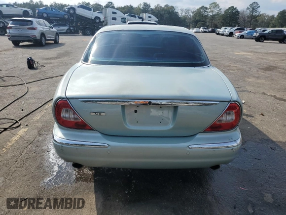 2004 Jaguar XJ with VIN SAJWA71C94SG24466, listed as a Copart auction lot 46610995 with 173,570 mi miles and Salvage Title. Bid and sale history available at carsss.com. Image 6.