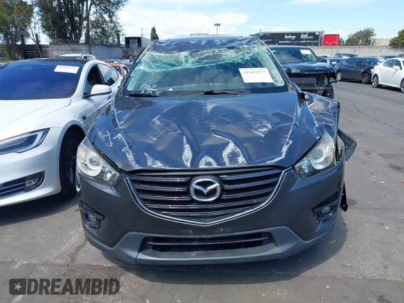 2016 Mazda CX-5 Touring with VIN JM3KE2CY6G0832967, listed as a IAAI auction lot 41943527 with 1 mi miles. Bid and sale history available at carsss.com. Image 13.
