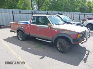 1984 Datsun 720 z VIN JN6ND06Y5EW020107, wystawiony jako IAAI lot #42281402 z przebiegiem 224 687 mil mil oraz . Historia ofert i sprzedaży dostępna na DreamBid. Obrazek 1.