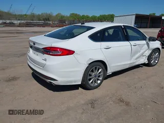 2017 Ford Fusion Hybrid SE z VIN 3FA6P0LU8HR396572, wystawiony jako IAAI lot #41997684 z przebiegiem 272 803 mil mil oraz . Historia ofert i sprzedaży dostępna na DreamBid. Obrazek 4.