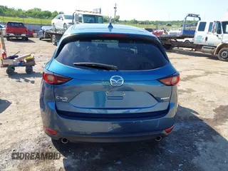 2020 Mazda CX-5 Touring z VIN JM3KFBCM2L0848233, wystawiony jako IAAI lot #42189719 z przebiegiem 80 893 mil mil oraz . Historia ofert i sprzedaży dostępna na DreamBid. Obrazek 17.