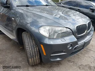 2011 BMW X5 35i with VIN 5UXZV4C56BL406632, listed as a IAAI auction lot 41981590 with 168,534 mi miles. Bid and sale history available at carsss.com. Image 6.