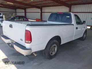 1999 Ford F-150 with VIN 1FTZF1721XKB63483, listed as a IAAI auction lot 42327278 with Not provided miles and . Bid and sale history available at DreamBid. Image 4.