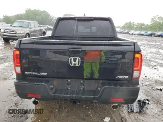 2023 Honda Ridgeline RTL with VIN 5FPYK3F51PB067811, listed as a Copart auction lot 56795995 with 21,500 mi miles and Salvage title. Bid and sale history available at DreamBid. Image 6.