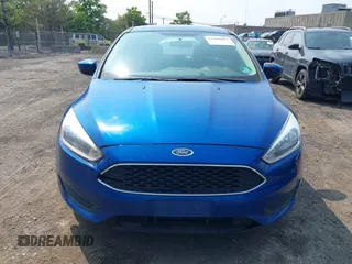 2018 Ford Focus SE z VIN 1FADP3FE1JL254632, wystawiony jako IAAI lot #42408683 z przebiegiem 74 696 mil mil oraz . Historia ofert i sprzedaży dostępna na DreamBid. Obrazek 12.