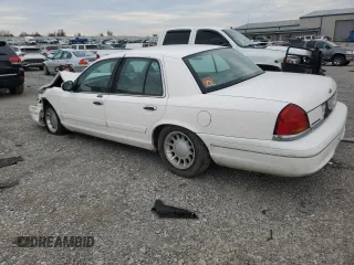 2000 Ford Crown Victoria LX z VIN 2FAFP74W4YX120352, wystawiony jako Copart lot #79833264 z przebiegiem Nie podano mil oraz Szkoda całkowita • Salvage title. Historia ofert i sprzedaży dostępna na DreamBid. Obrazek 2.