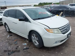 2013 Honda Odyssey Touring with VIN 5FNRL5H96DB074819, listed as a IAAI auction lot 41898358 with 123,428 mi miles and . Bid and sale history available at carsss.com. Image 1.