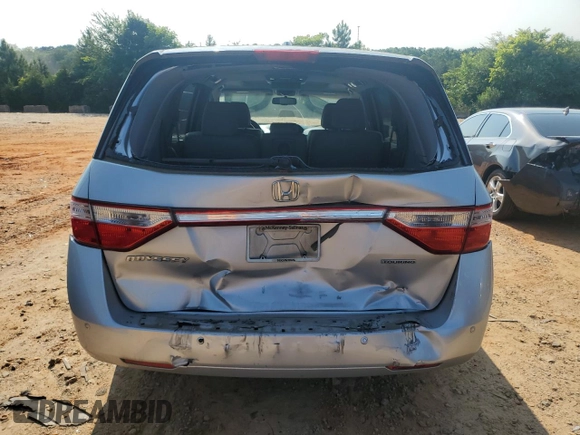 2012 Honda Odyssey Touring с VIN 5FNRL5H93CB137468, выставлен на аукционе Copart как лот 59330545 с пробегом 105 880 миль миль и Списание • Salvage title. История ставок и продаж доступна на DreamBid. Изображение 6.