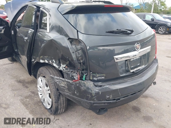 2015 Cadillac SRX with VIN 3GYFNAE30FS569009, listed as a IAAI auction lot 41718522 with 104,448 mi miles and . Bid and sale history available at DreamBid. Image 6.
