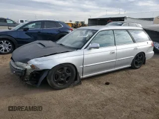 1996 Subaru Legacy with VIN 4S3BK6655T7319088, listed as a Copart auction lot 48593005 with 195,810 mi miles and Salvage title. Bid and sale history available at DreamBid. Image 1.