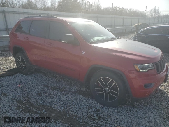 2017 Jeep Grand Cherokee Trailhawk with VIN 1C4RJFLT0HC667691, listed as a Copart auction lot 42041705 with 129,757 mi miles and Salvage title. Bid and sale history available at DreamBid. Image 4.