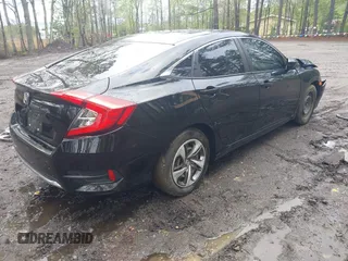 2019 Honda Civic LX with VIN 19XFC2F64KE041024, listed as a IAAI auction lot 42020159 with 36,870 mi miles and . Bid and sale history available at DreamBid. Image 4.