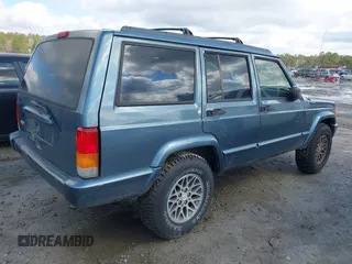 1998 Jeep Cherokee Sport with VIN 1J4FT68S0WL125382, listed as a IAAI auction lot 41551866 with 1 mi miles. Bid and sale history available at carsss.com. Image 4.