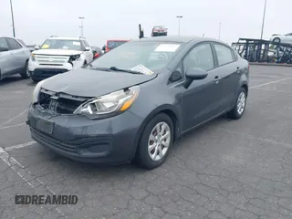 2013 Kia Rio SX with VIN KNADN4A33D6294075, listed as a IAAI auction lot 41728082 with 119,297 mi miles. Bid and sale history available at carsss.com. Image 2.