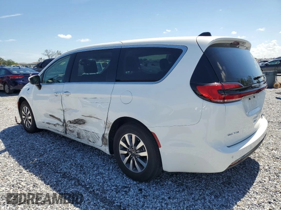 2023 Chrysler Pacifica Hybrid Touring L z VIN 2C4RC1L74PR558768, wystawiony jako Copart lot #61407555 z przebiegiem 70 387 mil mil oraz Czysty tytuł • Clean title. Historia ofert i sprzedaży dostępna na DreamBid. Obrazek 2.