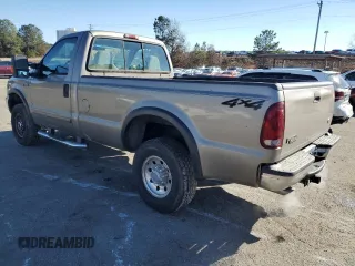 2002 Ford F-250 XL with VIN 1FTNF21L02EA83007, listed as a Copart auction lot 87880345 with 104,889 mi miles and Salvage title. Bid and sale history available at DreamBid. Image 2.
