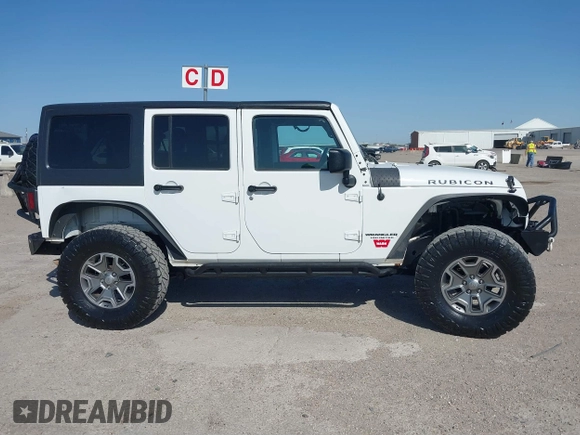 2014 Jeep Wrangler Unlimited Rubicon with VIN 1C4BJWFG1EL167423, listed as a IAAI auction lot 41861109 with 104,669 mi miles. Bid and sale history available at carsss.com. Image 13.