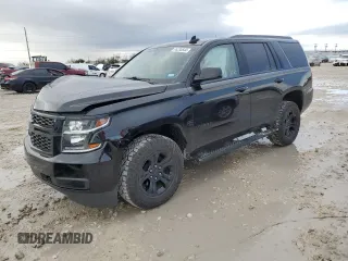 2019 Chevrolet Tahoe LS z VIN 1GNSKAKC4KR363987, wystawiony jako Copart lot #85335544 z przebiegiem 26 926 mil mil oraz Szkoda całkowita • Salvage title. Historia ofert i sprzedaży dostępna na DreamBid. Obrazek 1.