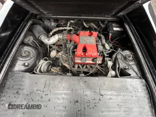 1988 Pontiac Fiero z VIN 1G2PE119XJP213392, wystawiony jako Copart lot #76264064 z przebiegiem 71 246 mil mil oraz Tytuł czysty. Historia ofert i sprzedaży dostępna na DreamBid. Obrazek 7.