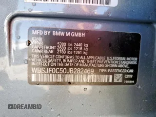 2018 BMW M5 z VIN WBSJF0C50JB282469, wystawiony jako Copart lot #46794335 z przebiegiem Nie podano mil oraz Szkody całkowita. Historia ofert i sprzedaży dostępna na DreamBid. Obrazek 12.