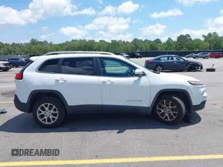 2016 Jeep Cherokee Latitude with VIN 1C4PJLCB0GW291357, listed as a IAAI auction lot 42312356 with 105,692 mi miles and . Bid and sale history available at DreamBid. Image 14.