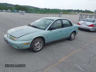 1996 Saturn SL with VIN 1G8ZK5277TZ340863, listed as a IAAI auction lot 42513568 with 130,286 mi miles and . Bid and sale history available at DreamBid. Image 2.