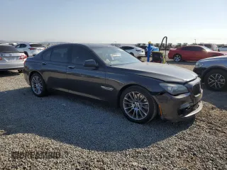 2011 BMW 7 Series 750i with VIN WBAKA8C58BCY37346, listed as a Copart auction lot 65017655 with 125,505 mi miles and Salvage title. Bid and sale history available at DreamBid. Image 4.