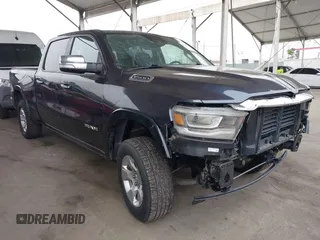 2020 Ram 1500 Laramie with VIN 1C6SRFRT4LN352298, listed as a IAAI auction lot 42814922 with 59,893 mi miles and . Bid and sale history available at DreamBid. Image 1.